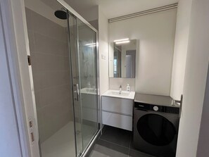 Shower, towels, soap, toilet paper