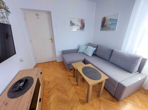 Apartment (One Bedroom Apartment) | Living room | 30-inch flat-screen TV with cable channels - Sea View Crikvenica Apartment With Balcony and Free Wifi (Crikvenica)
