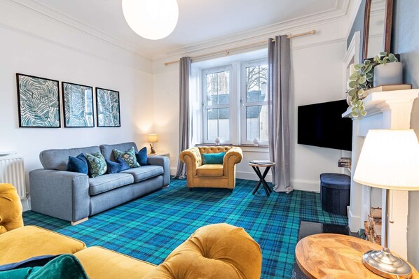 TV, fireplace, books