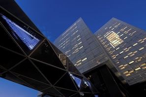 A modern building with a glass facade and a geometric design. -  Atheel KAFD Hotel (Riyadh)