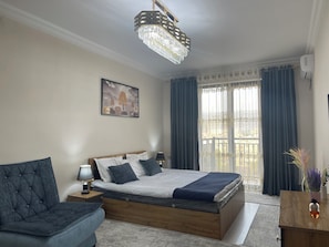 Family Condo, Balcony, City View | Blackout drapes, iron/ironing board, free WiFi