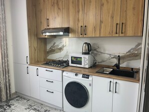 Family Condo, Balcony, City View | Private kitchen | Electric kettle