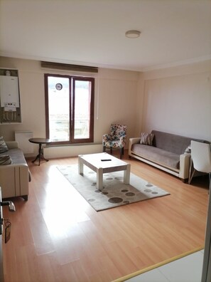 Standard Room, City View | Living area | TV