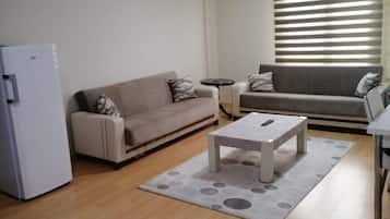Superior-Zimmer, Stadtblick | Wohnbereich | Fernseher