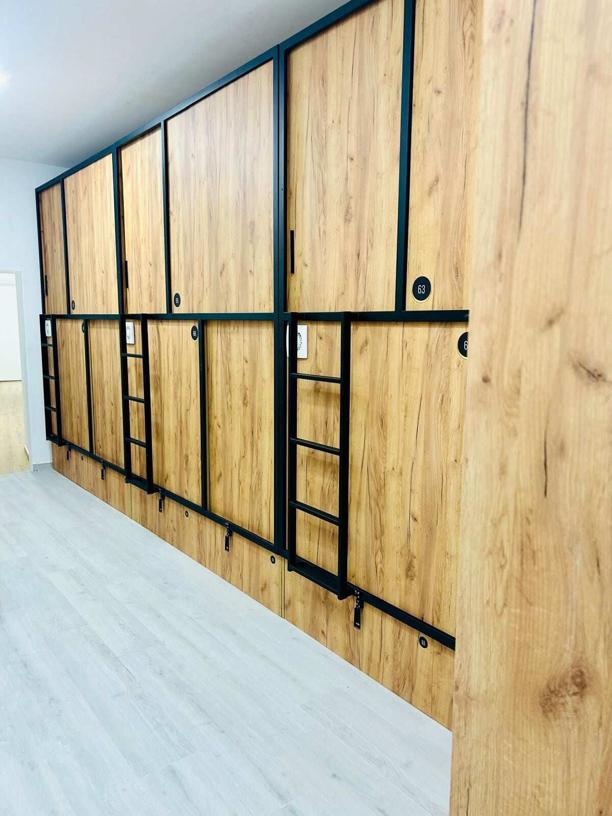 A room with a wooden panel wall and a light-colored floor.