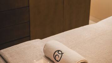Experience serenity in this minimalist bathroom, featuring a wooden vanity and a warm, inviting atmosphere.