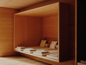 A minimalist wooden room with built-in beds and a sloped ceiling. - Rote Wand Gourmet Hotel, a Member of Design Hotels (Lech am Arlberg)