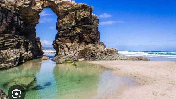 A natural rock formation with a clear water pool and a sandy beach. - NOAH'S ARK (Valle de Oro)