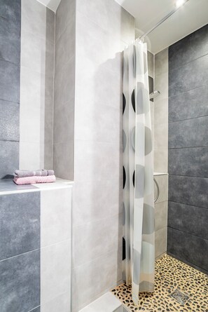 Shower, hair dryer, towels, soap