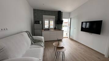 Superior Apartment, City View | Living room | Flat-screen TV