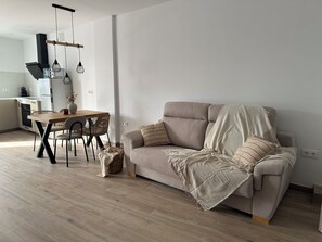 Superior Apartment, Garden View | Living room | Flat-screen TV - Casa rural Los Alcornocales (Alcala de los Gazules)