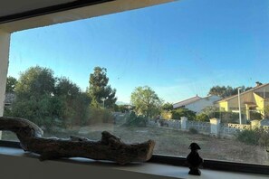 Enjoy a serene view of the surrounding neighborhood from the comfort of your room.