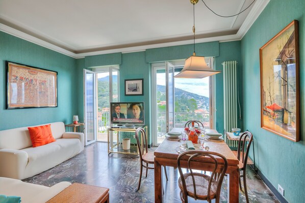 Standard Apartment, Multiple Bedrooms (Simply Romantic Sea View) | Living area | Flat-screen TV