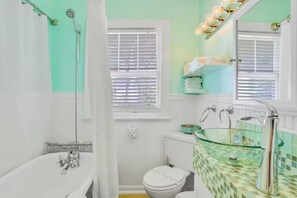 Shower, hair dryer, towels, shampoo