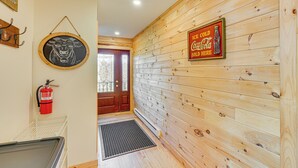 A wooden interior with a fire extinguisher, a framed picture, and a Coca-Cola sign. - Cabin 4 Mi to Belleayre Mountain: Ski, Hike & Fish (Fleischmanns)