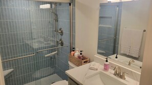 Shower, hair dryer, towels, toilet paper