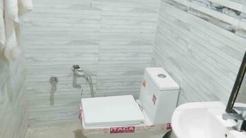 Shower, rainfall showerhead, towels, soap