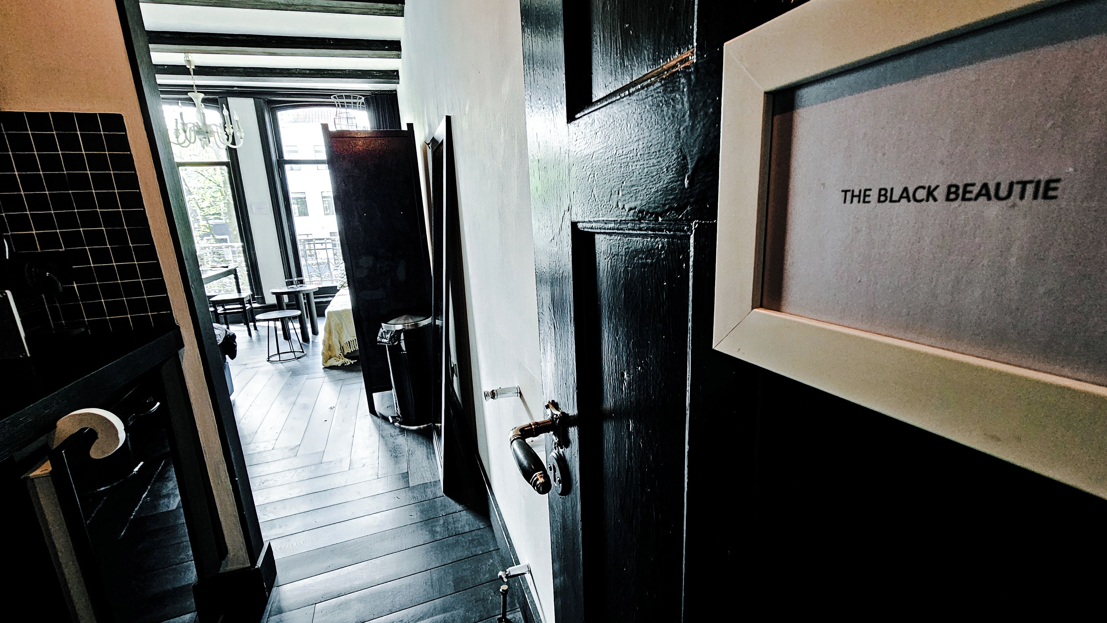 A hallway with a door labeled "The Black Beauty."