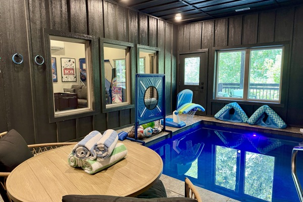 Indoor heated pool room with toys, fun games and a cozy spot to chill!
