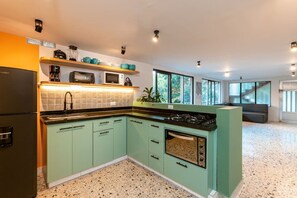 Microwave, oven, coffee/tea maker, cookware/dishes/utensils