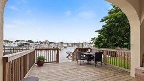 A wooden deck with a view of a marina and boats. - Intracoastal Views + Dog-Friendly | Walk to Marina | Near Historic St. Augustine (St. Augustine)