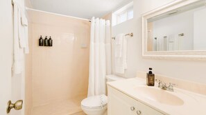 A bathroom with a toilet, sink, and shower area. - Harbor View Charm, King Bed, Balcony (St. Augustine)
