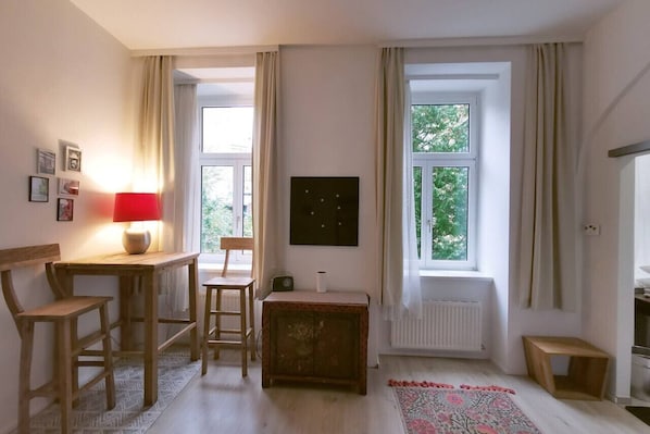 Apartment, Courtyard View | Living area | 140-cm flat-screen TV with digital channels, offices