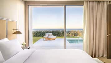 Lakens van Egyptisch katoen, luxe beddengoed, een minibar, een bureau