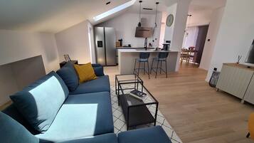 Apartment (Two Bedroom Apartment with Balcony an) | Living room | 32-inch flat-screen TV with cable channels