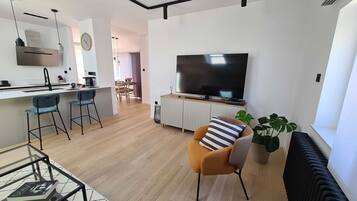 Apartment (Two Bedroom Apartment with Balcony an) | Living room | 32-inch flat-screen TV with cable channels