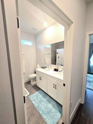 Shower, hair dryer, towels, soap