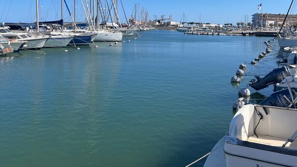 A marina with multiple sailboats docked, a clear blue sky, and a calm water surface. - LaVillaMaurice: A small, family-run fisherman's cottage—Summer 2026 Special (Valras plage)