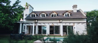 Comfortable house with swimming pool and garden in warehouse area