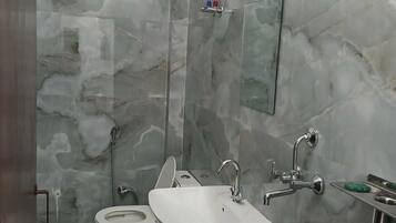 Shower, towels, soap, toilet paper