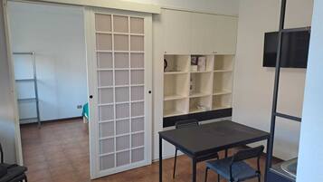 Deluxe Studio | Living area | 32-inch flat-screen TV with cable channels