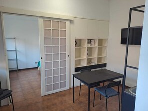 Deluxe Studio | Living area | 32-inch flat-screen TV with cable channels