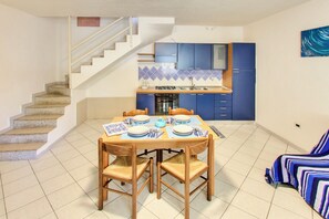 Apartment | Living area | 24-inch flat-screen TV with satellite channels