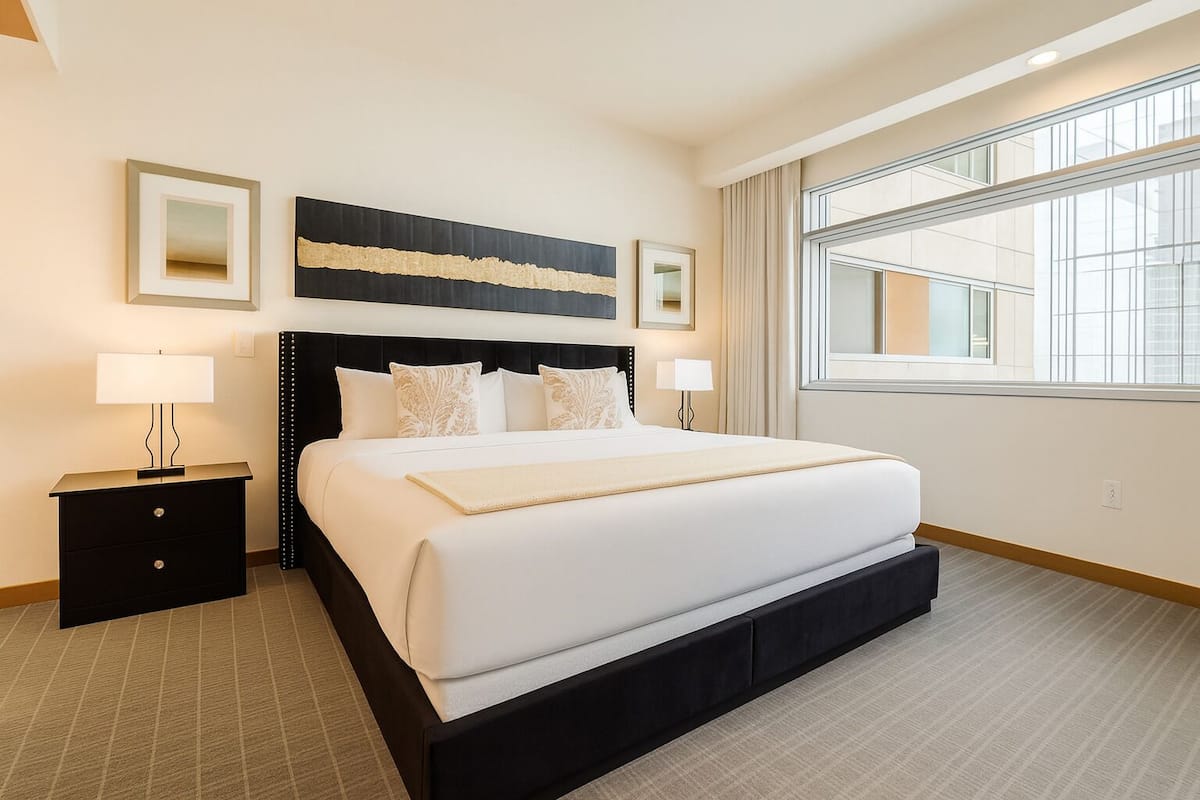 Deluxe Condo, 1 Bedroom, Balcony, Partial Sea View | 1 bedroom, Egyptian cotton sheets, premium bedding, down duvets