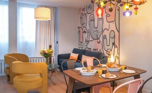 Deluxe Apartment | Living area | 100-cm TV with cable channels - West Paris Suite  (Paris)