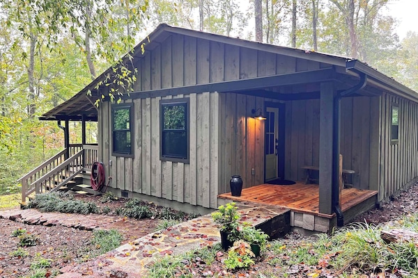The covered side porch is used for the main entry to the Cottage.