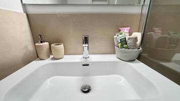 Hair dryer, towels, soap, toilet paper