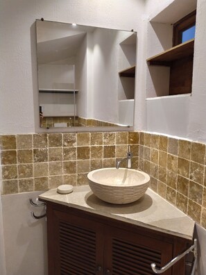 A bathroom with a large mirror, a vessel sink, and a tiled backsplash. - Le Four à pain, golden triangle Dordogne valley, views garden park swimming pool (saint cybranet)