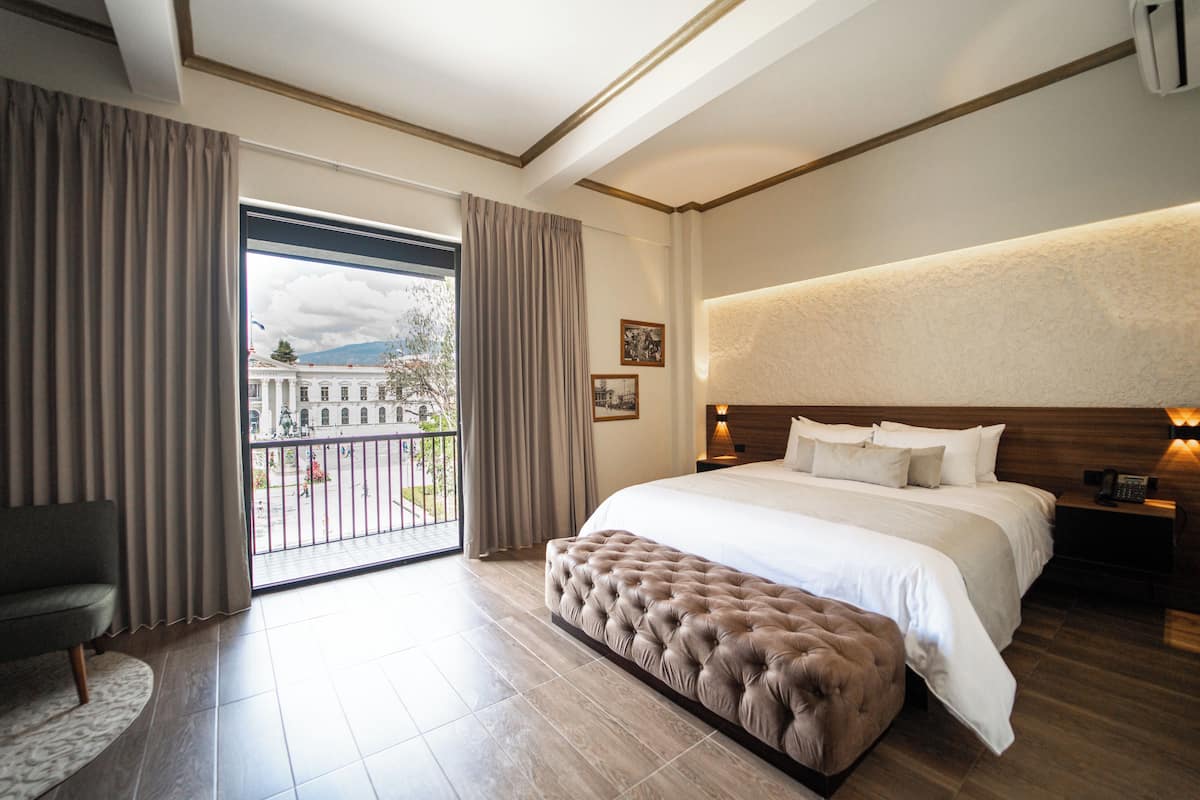 Suite, 1 King Bed, City View | 1 bedroom, in-room safe, desk, iron/ironing board