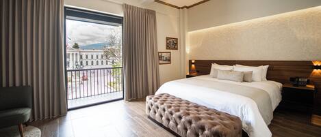 Suite, 1 King Bed, City View | 1 bedroom, in-room safe, desk, iron/ironing board
