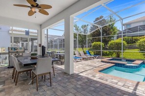 Outdoor dining - EV_9026 - 6 Bed 6 Bath Home with Screened-In Private Pool with Spillover Spa and (Davenport)