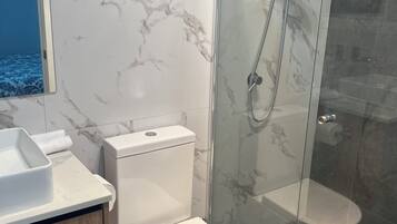 Shower, hair dryer, towels, soap