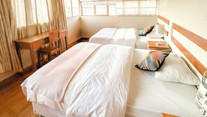 A room with two beds, a desk, and a chair. - Incredible apartment in the historic center of Cusco  (Cusco)
