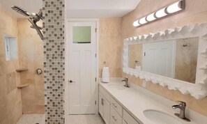 Shower, hair dryer, towels, shampoo