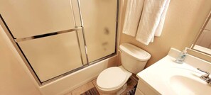 Shower, hair dryer, towels, shampoo