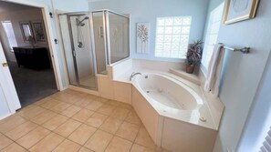 Shower, hair dryer, towels, shampoo